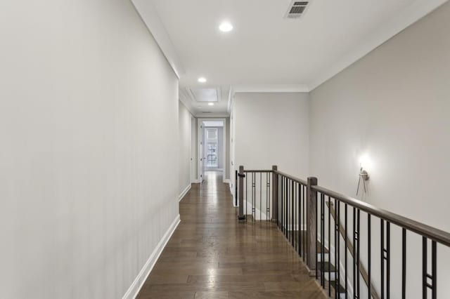 hallway with an upstairs landing, recessed lighting, baseboards, visible vents, and wood finished floors