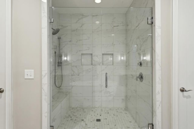 bathroom with a shower stall
