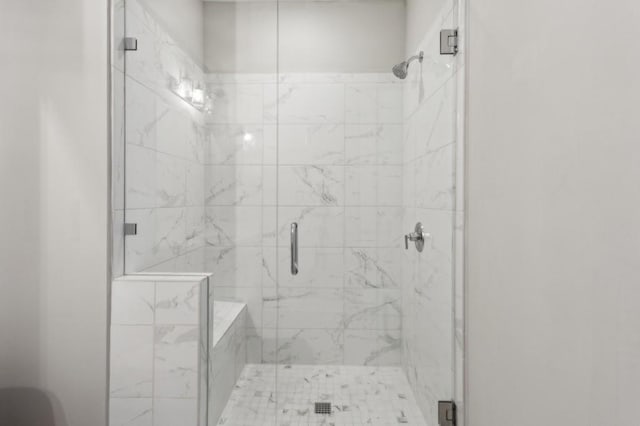 bathroom with a shower stall
