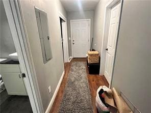 hallway with dark wood-type flooring