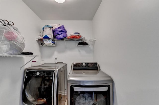 laundry area featuring laundry area and washing machine and clothes dryer