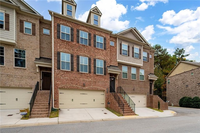 townhome / multi-family property featuring a garage