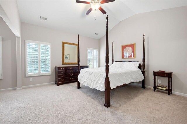 carpeted bedroom featuring lofted ceiling and ceiling fan