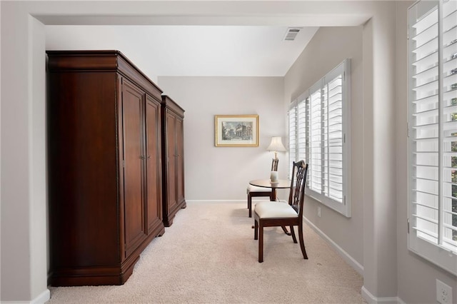 living area with light carpet