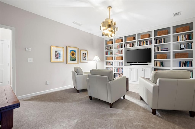 carpeted living room with an inviting chandelier