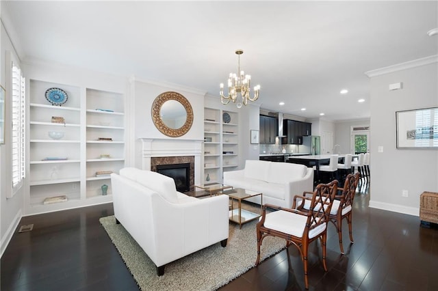 living room with ornamental molding, a wealth of natural light, dark hardwood / wood-style floors, and a fireplace