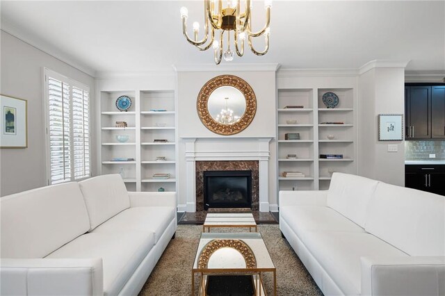 living room featuring a fireplace and a chandelier