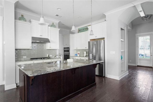 244 Rope Mill Rd, Woodstock, GA 30188 - kitchen with stainless steel appliances, under cabinet range hood, baseboards, dark wood-style flooring, and a breakfast bar
