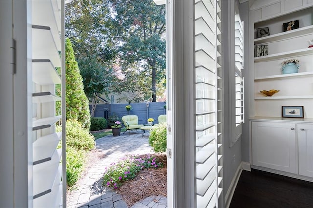 244 Rope Mill Rd, Woodstock, GA 30188 - doorway featuring built in features and dark wood-style flooring