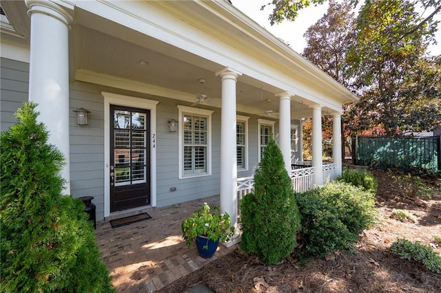 view of exterior entry with a porch