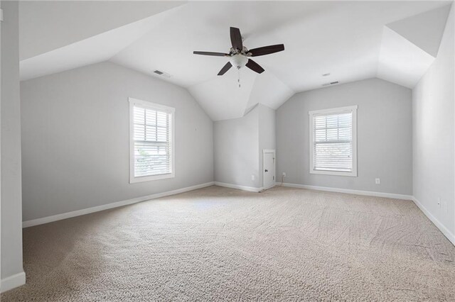 244 Rope Mill Rd, Woodstock, GA 30188 - bonus room featuring healthy amount of natural light, lofted ceiling, light carpet, and baseboards