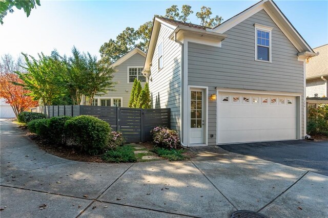 244 Rope Mill Rd, Woodstock, GA 30188 - view of side of property featuring driveway and a garage