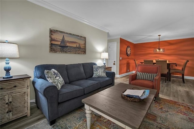 living room with hardwood / wood-style floors and ornamental molding