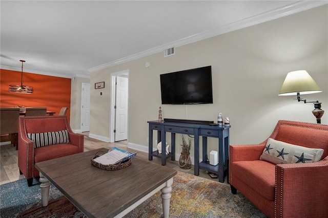 living room with hardwood / wood-style floors and crown molding