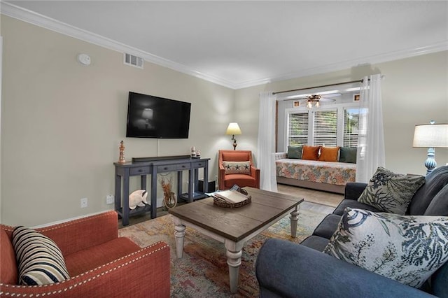 living room featuring ceiling fan and ornamental molding