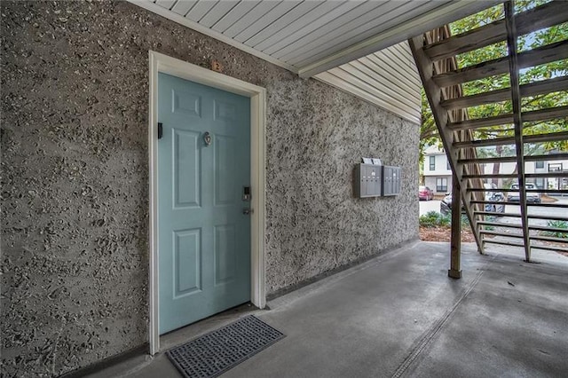 entrance to property with a patio