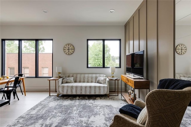 living room with wood finished floors and recessed lighting