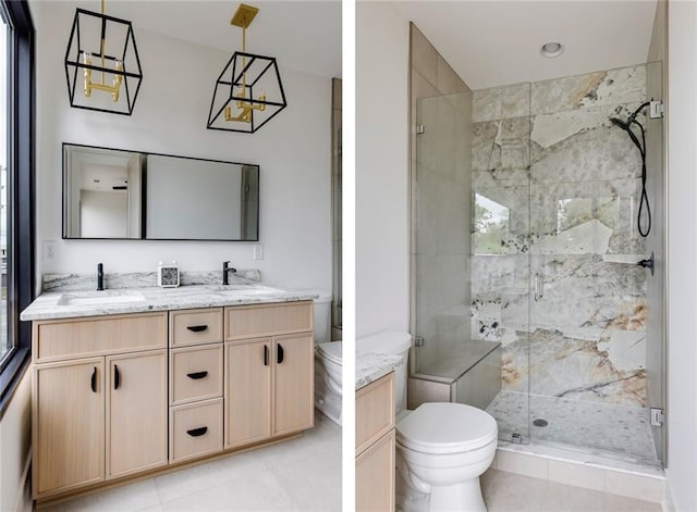 bathroom featuring toilet, a stall shower, double vanity, and tile patterned flooring