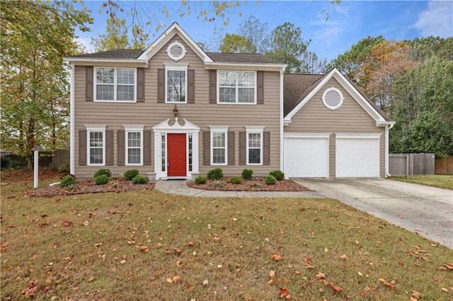 colonial house with a garage and a front yard