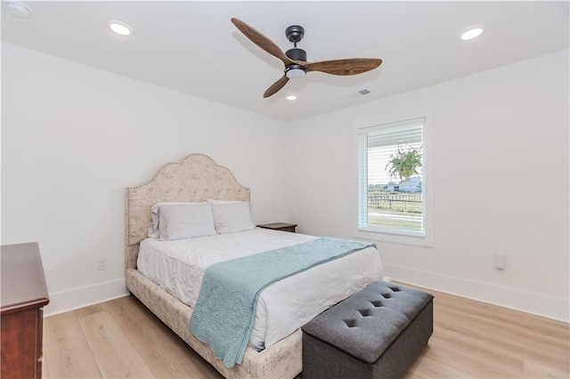 bedroom with ceiling fan and light wood-type flooring