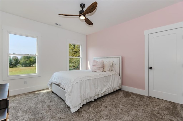 carpeted bedroom with ceiling fan