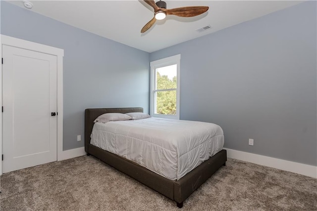 bedroom with ceiling fan and light colored carpet