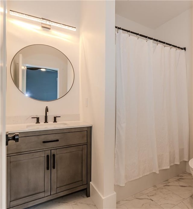 full bathroom with vanity, toilet, and shower / bath combo with shower curtain