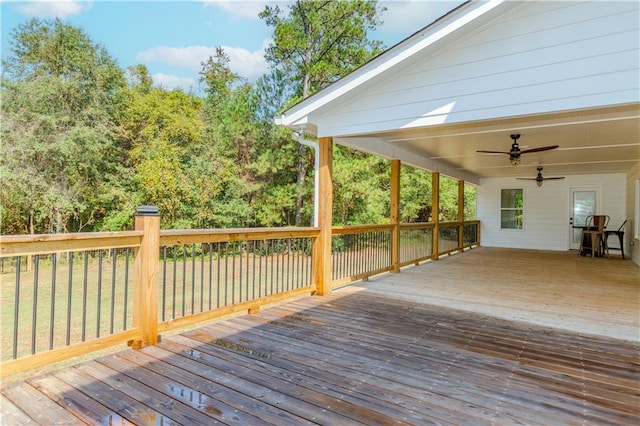 wooden deck featuring ceiling fan