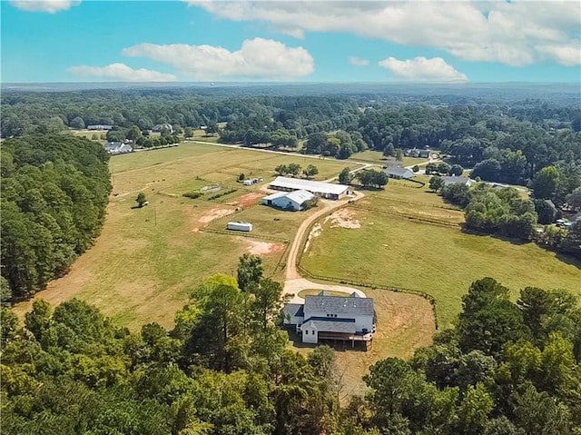 birds eye view of property with a rural view