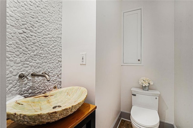 bathroom featuring toilet and vanity