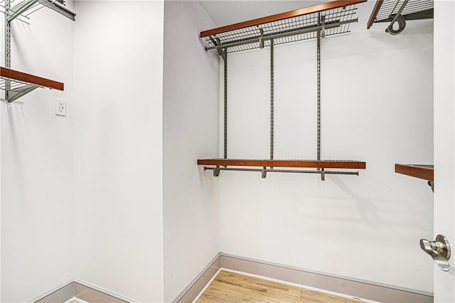 walk in closet featuring light wood-type flooring