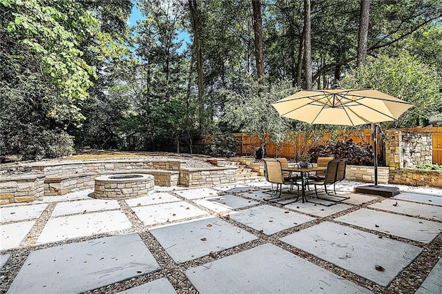 view of patio / terrace featuring a fire pit