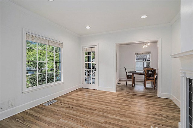 interior space featuring a chandelier, crown molding, and hardwood / wood-style floors