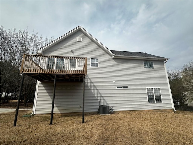 back of property featuring cooling unit and a wooden deck