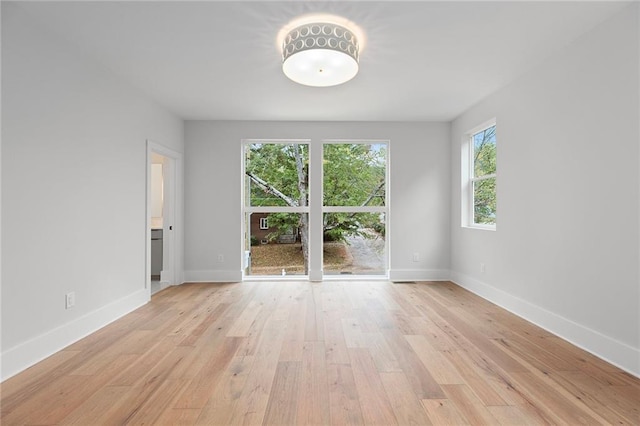 spare room featuring light wood-type flooring