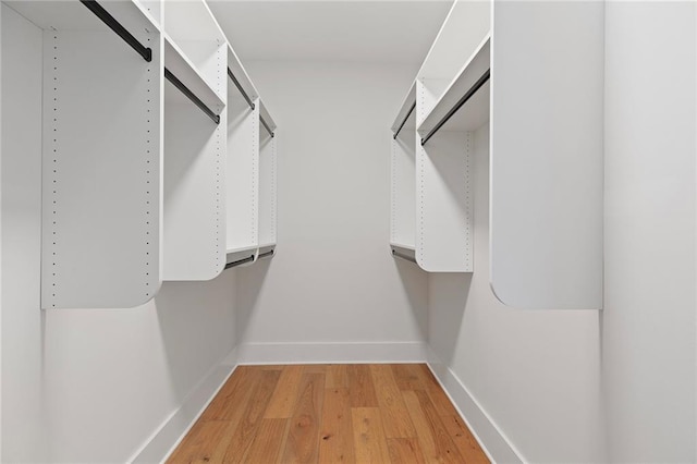 spacious closet with hardwood / wood-style floors