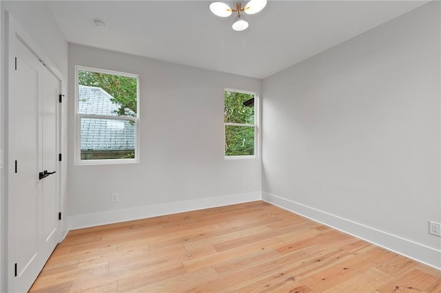 spare room featuring light hardwood / wood-style floors