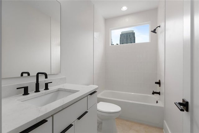 full bathroom featuring toilet, vanity, and tiled shower / bath