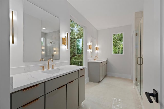 bathroom featuring vanity and an enclosed shower