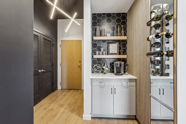 wine area featuring light hardwood / wood-style flooring