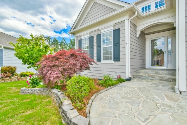 view of home's exterior with a yard