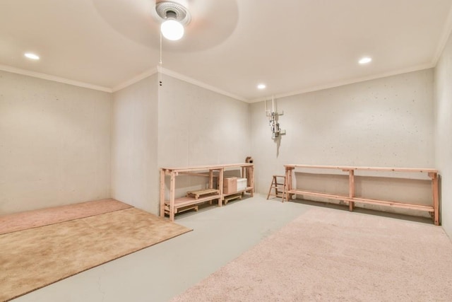 below grade area with ornamental molding, recessed lighting, a ceiling fan, and carpet flooring