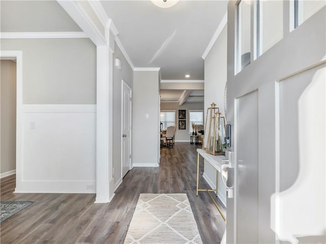 entryway featuring crown molding and dark hardwood / wood-style floors