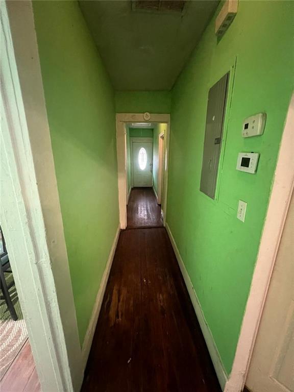 hallway featuring hardwood / wood-style floors and electric panel