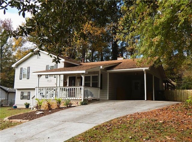 view of front of house with covered porch and a carport