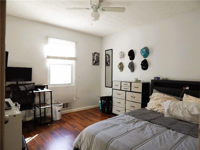 bedroom featuring ceiling fan and dark wood-type flooring