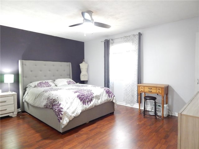 bedroom with ceiling fan and dark hardwood / wood-style flooring