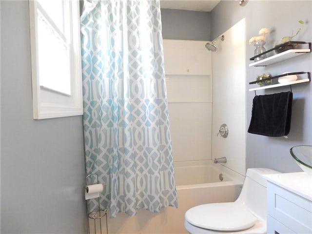 full bathroom with vanity, shower / bath combination with curtain, and toilet