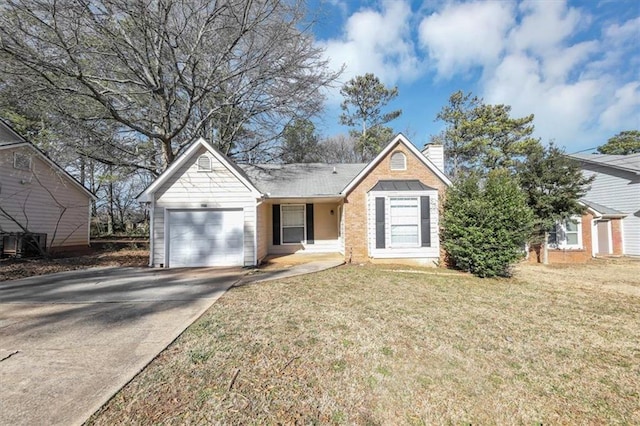 view of front of home featuring a garage and a front lawn