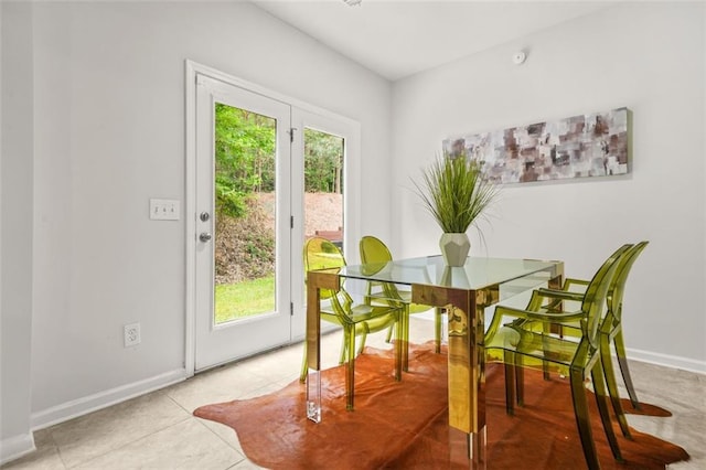6571 Splitpine Ct, Atlanta, GA 30349 - dining space featuring baseboards and light tile patterned flooring